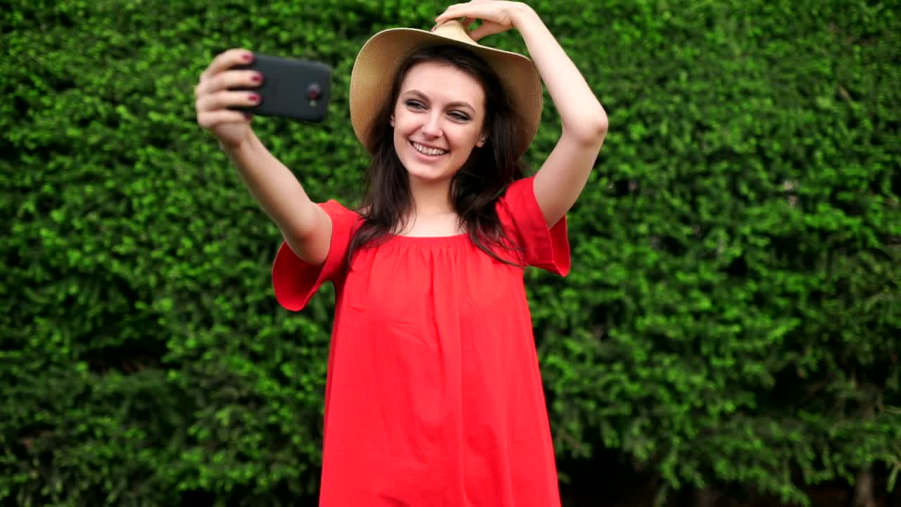 Stock Video Funny Girl Taking Selfies Wearing A Red Dress Live Wallpaper For PC