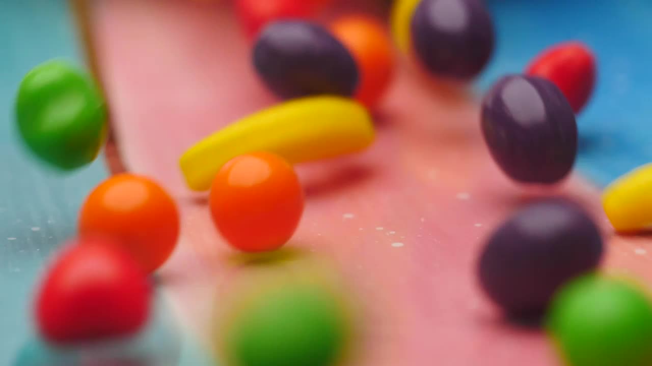 Stock Video Fruit Shaped Sweets Slowly Falling Into A Bowl Live Wallpaper For PC