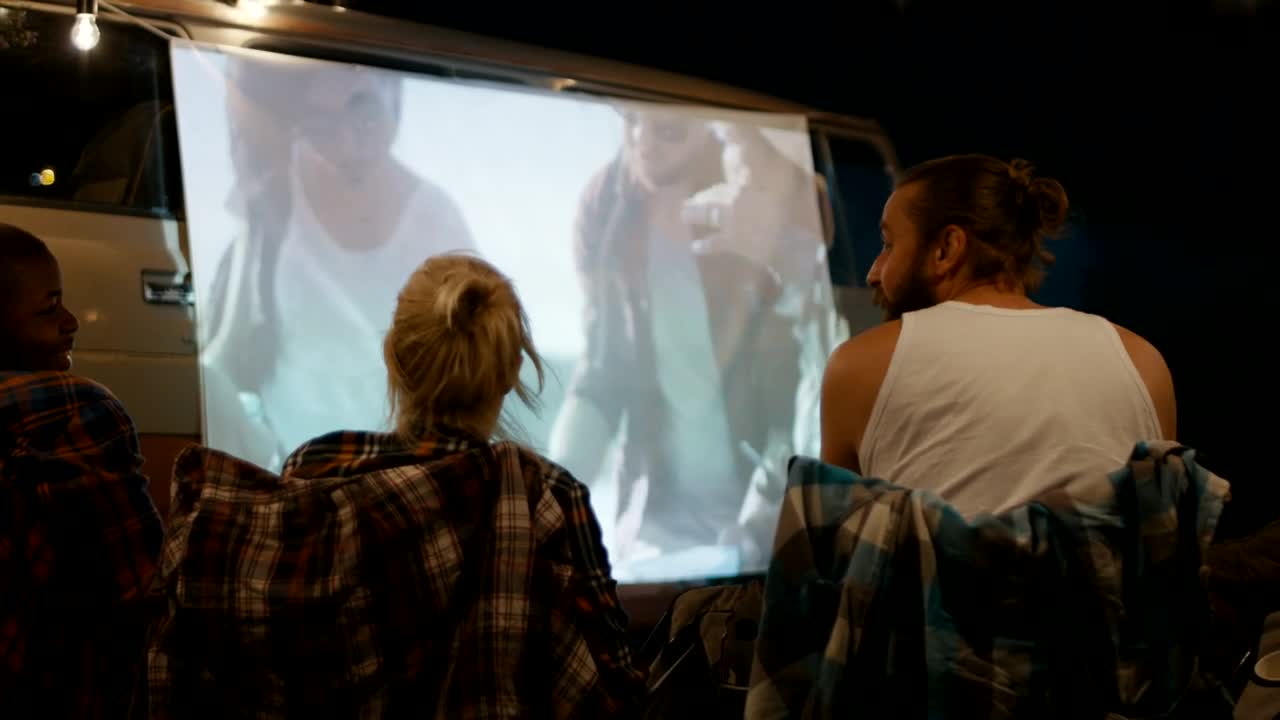 Stock Video Friends Watching A Movie At The Campsite Live Wallpaper For PC