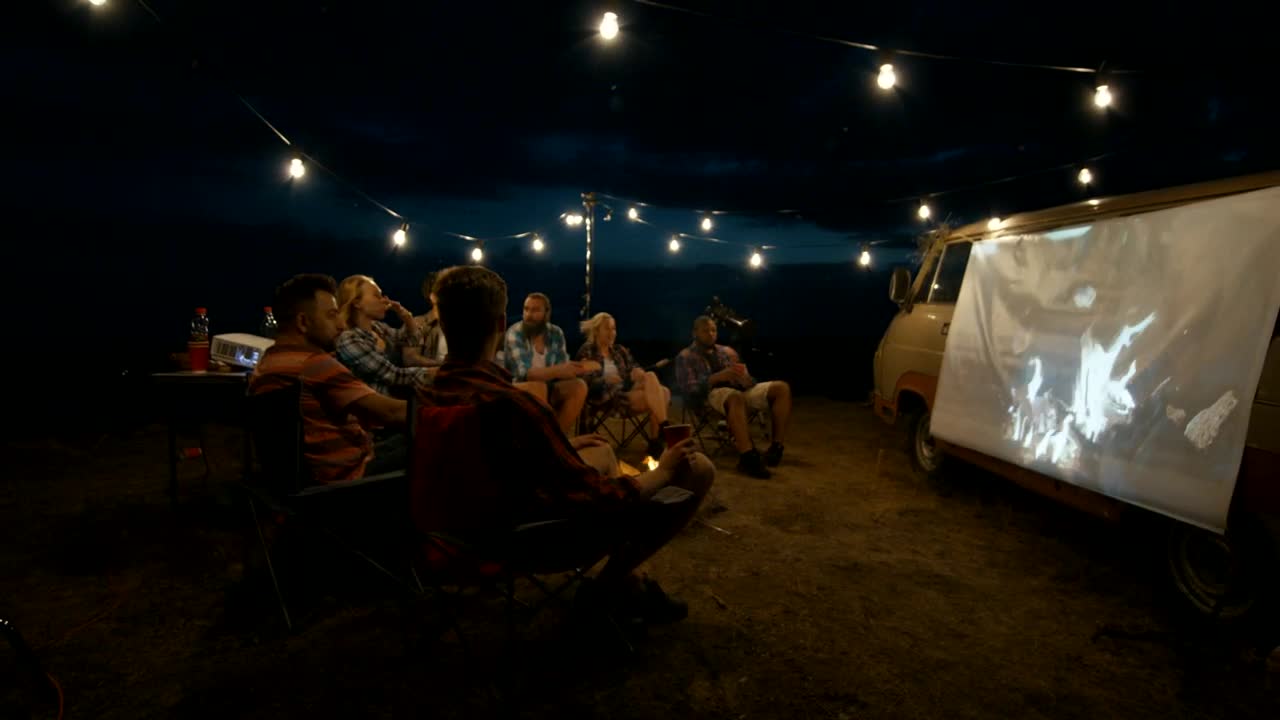 Stock Video Friends Watching A Movie At The Camp Live Wallpaper For PC