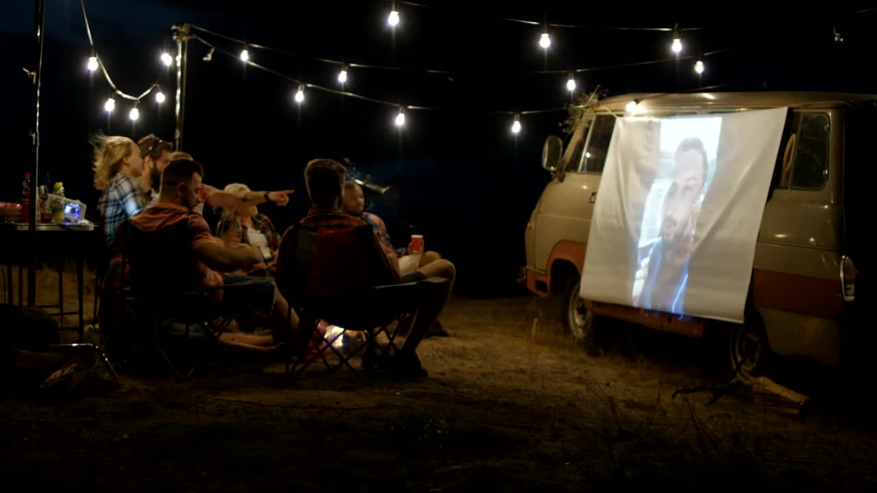 Stock Video Friends Watching A Live Stream With A Projection Live Wallpaper For PC