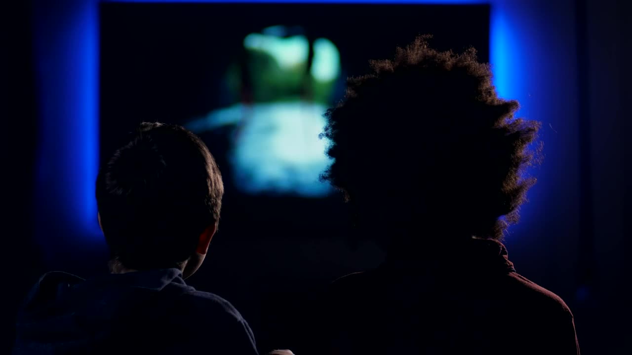 Stock Video Friends Watching A Film In A Dark Room Live Wallpaper For PC