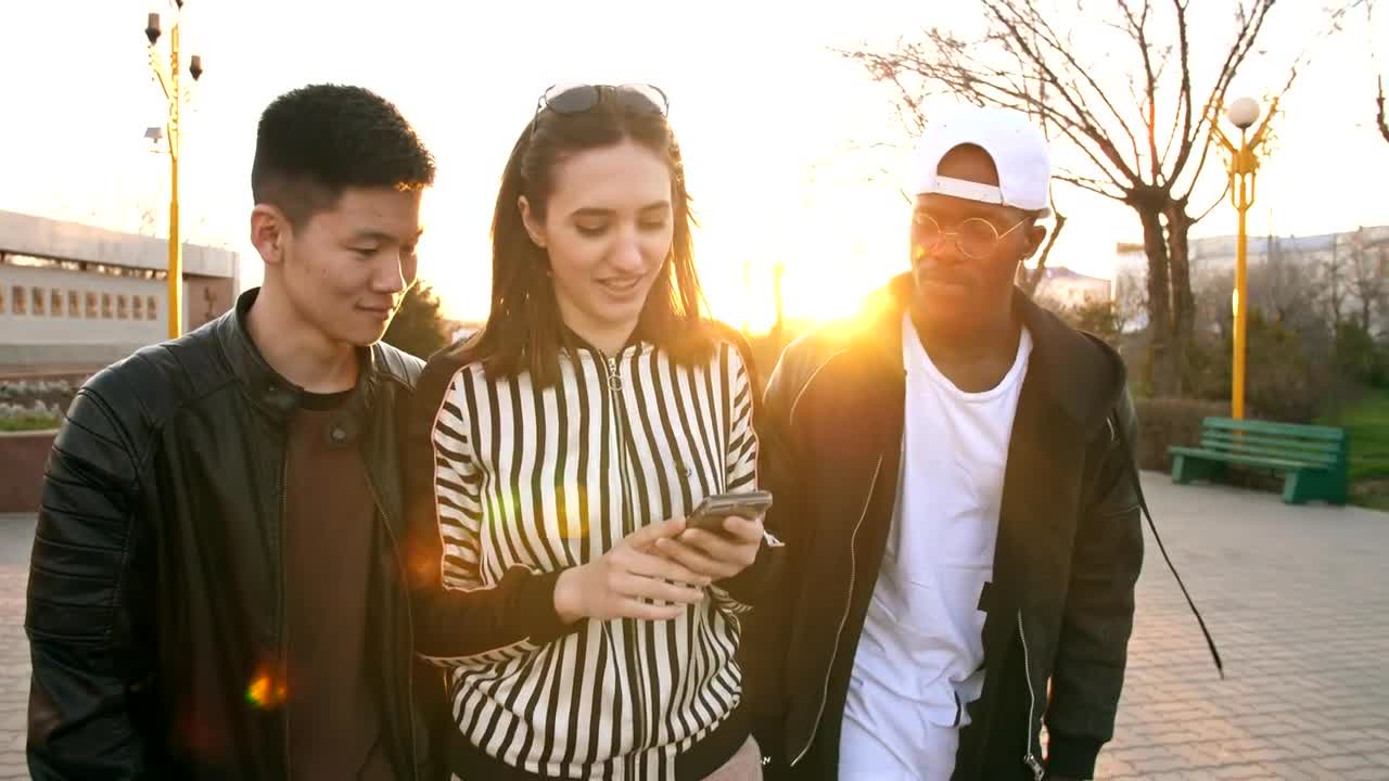 Stock Video Friends Walking Down The Street Watching Social Media Live Wallpaper For PC
