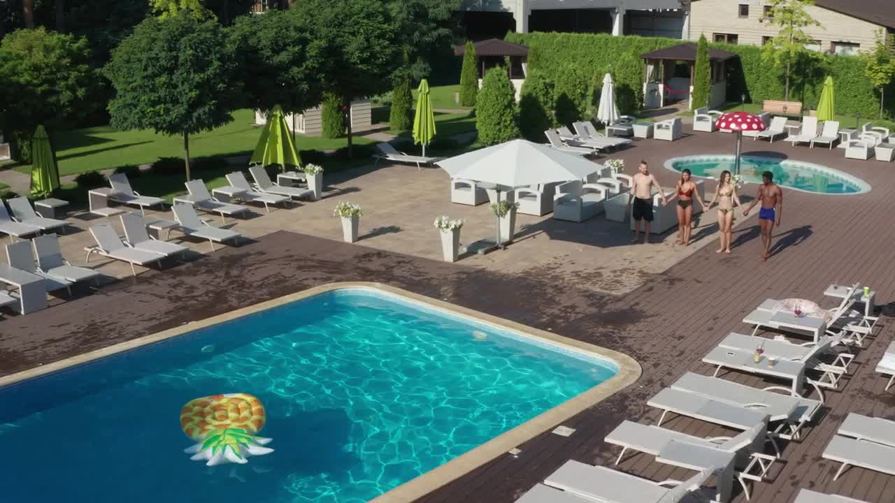 Stock Video Friends Throwing Themselves Into A Swimming Pool Live Wallpaper For PC