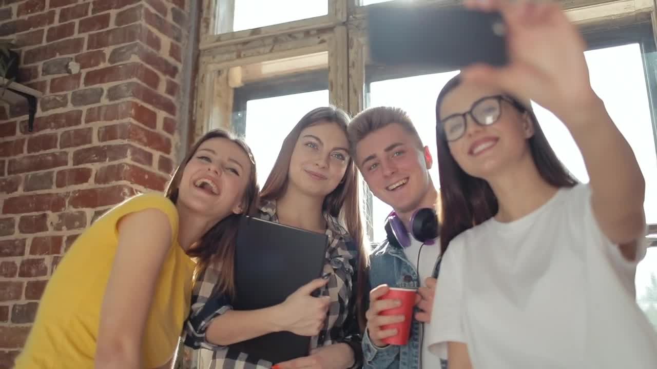 Stock Video Friends Smile For Group Selfie In Front Of Sunlit Window Live Wallpaper For PC