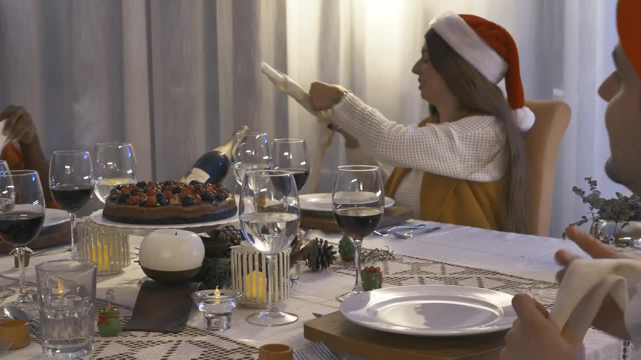 Stock Video Friends Sitting At A Table Setting For Christmas Dinner Live Wallpaper For PC