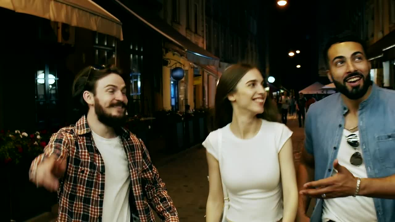 Stock Video Friends Laugh And Walk Down City Street At Night Live Wallpaper For PC