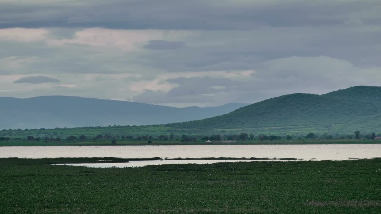 Stock Video Lake In The Middle Of A Plain Surrounded By Hills Animated Wallpaper