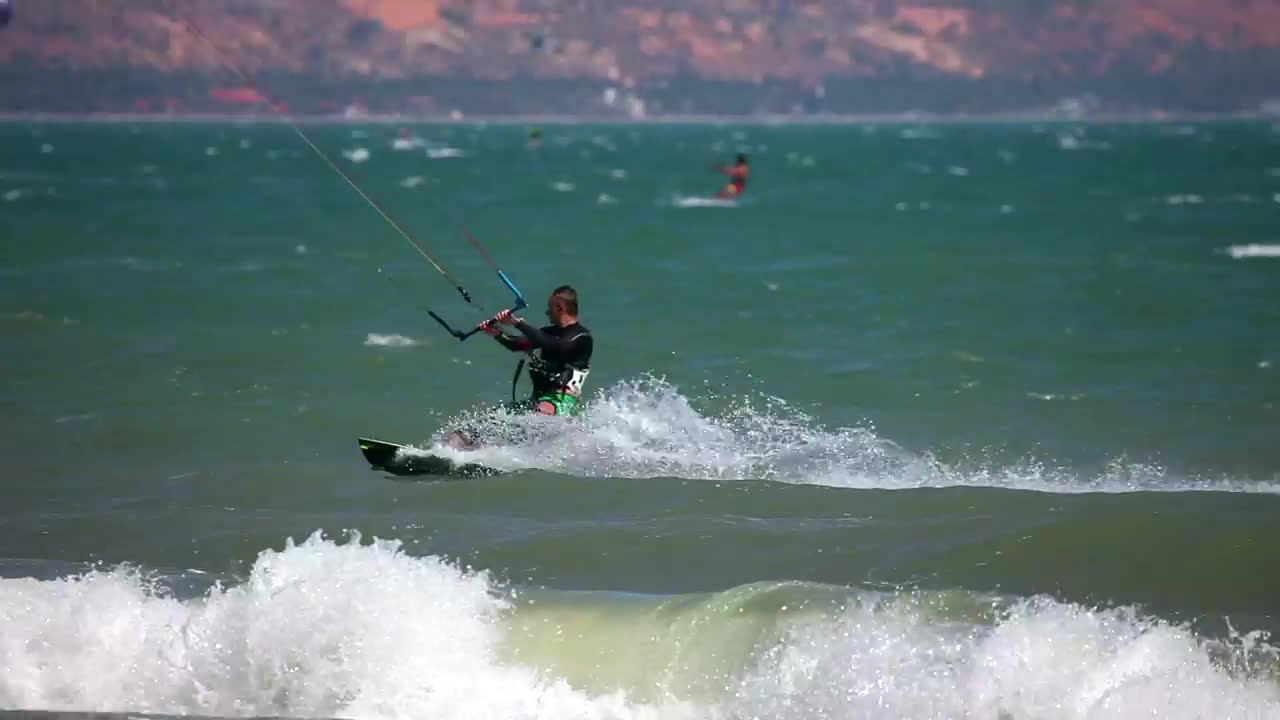 Stock Video Kite Surfer Riding The Waves Animated Wallpaper