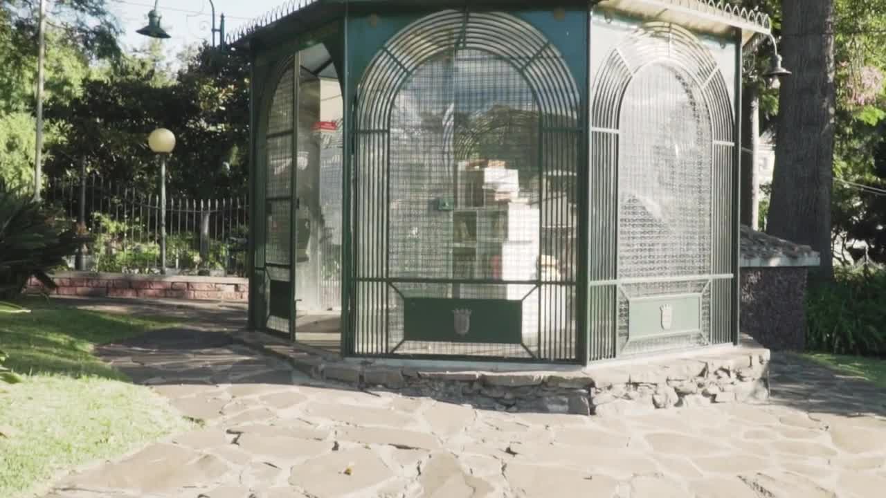 Stock Video Kiosk With Books Inside In A Garden Animated Wallpaper