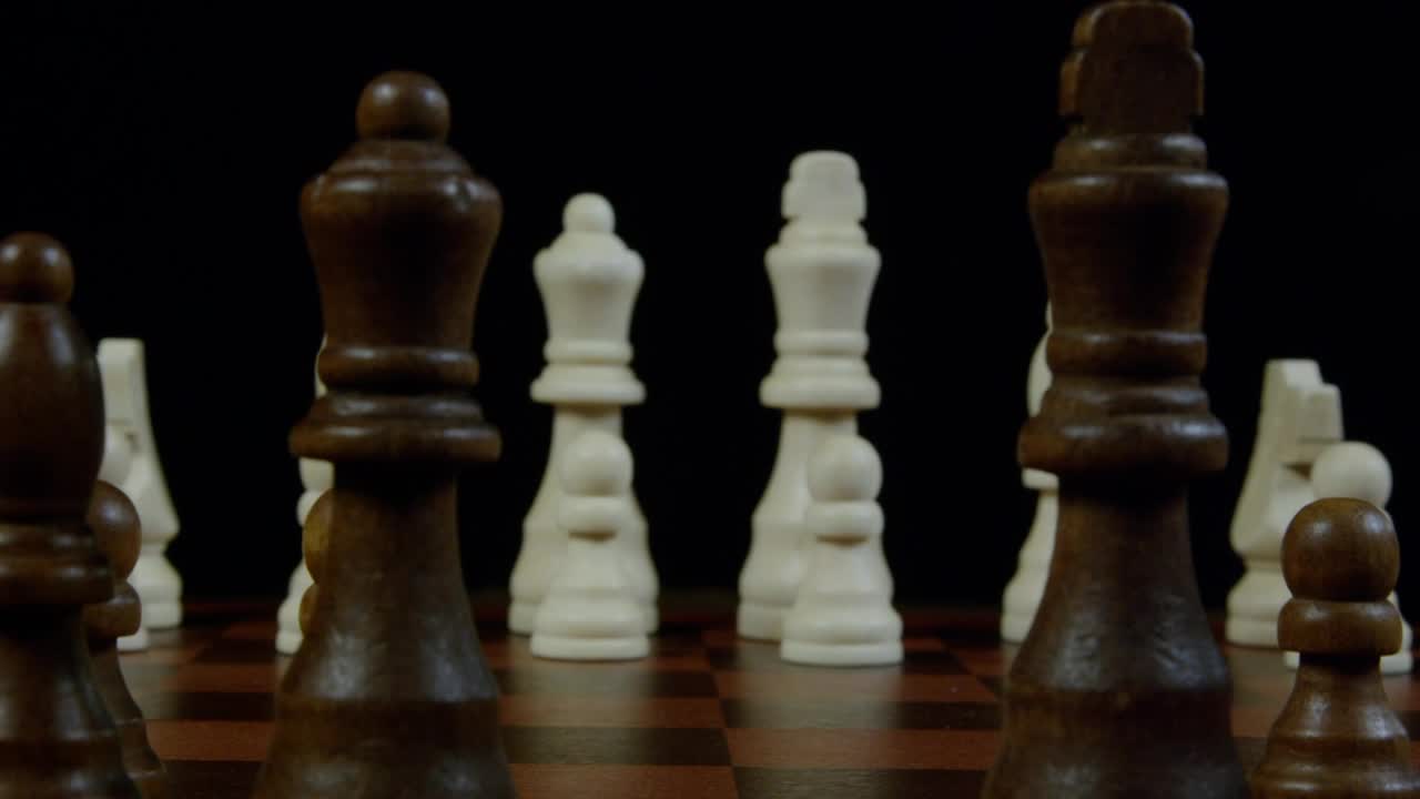 Stock Video King And Queen Across A Chessboard Animated Wallpaper