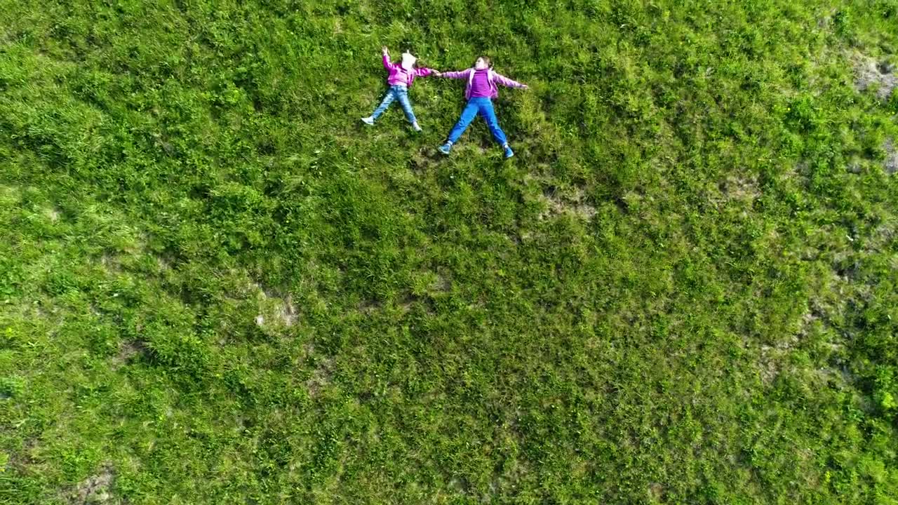 Stock Video Kids Layed In The Grass Top Aerial Shot Animated Wallpaper