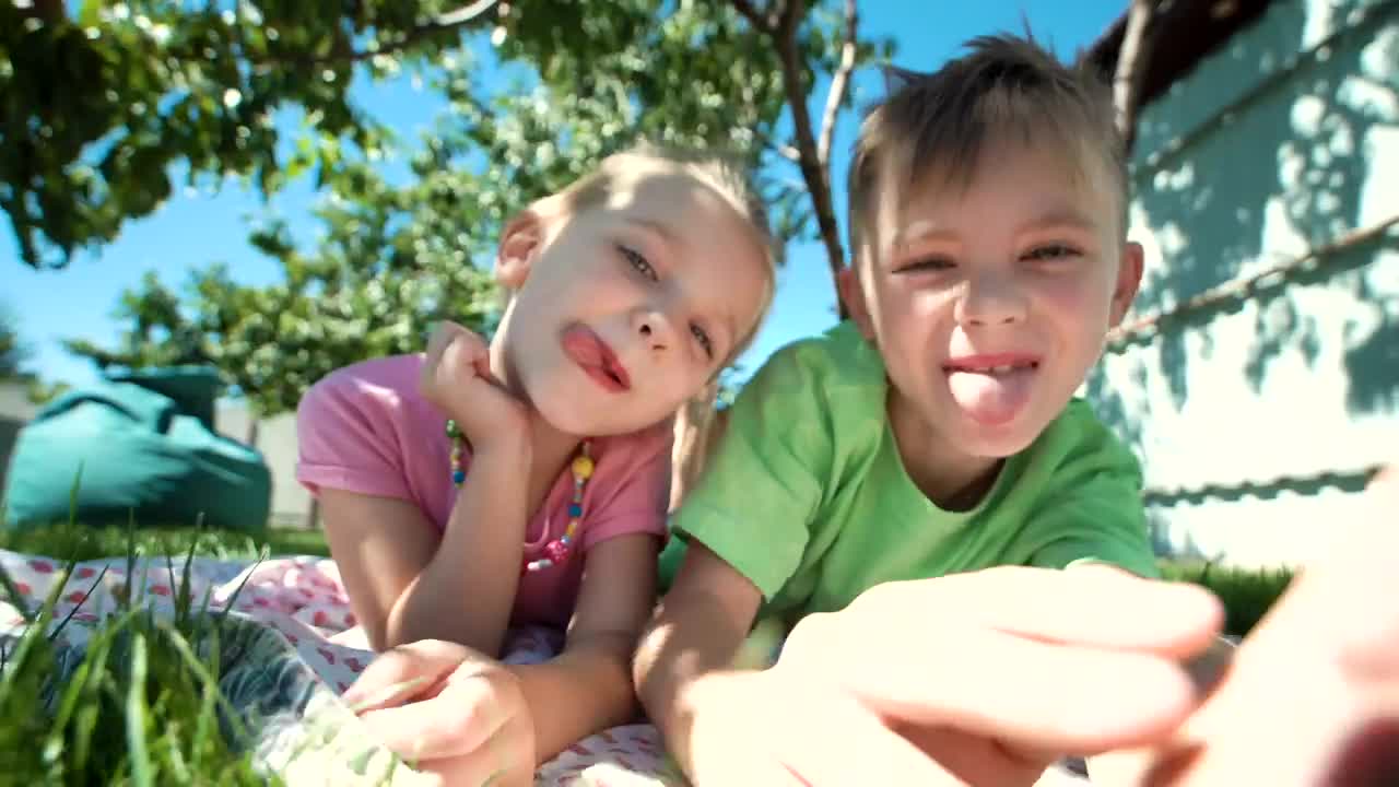 Stock Video Kids Grimacing In The Garden Animated Wallpaper