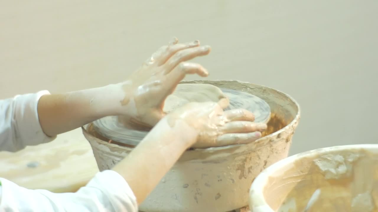 Stock Video Kid Working With Clay On A Pottery Wheel Animated Wallpaper