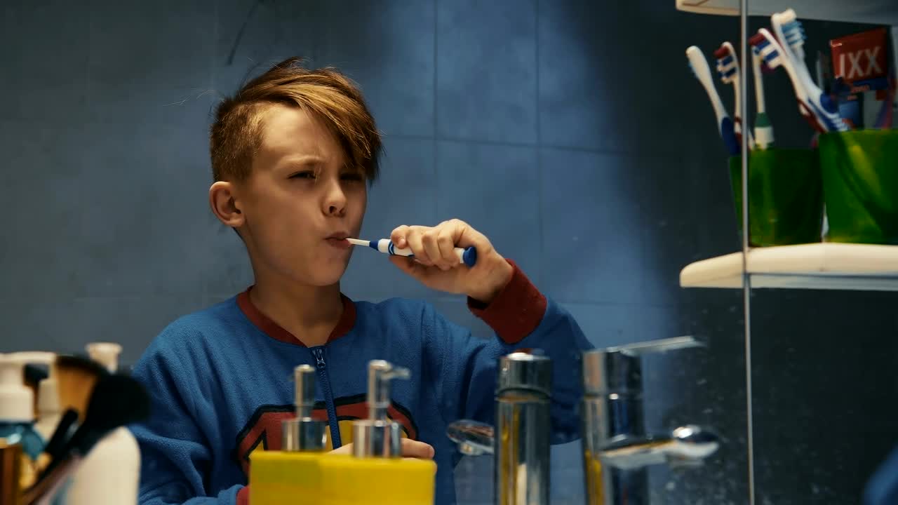 Stock Video Kid Brushing His Teeth In The Bathroom Animated Wallpaper