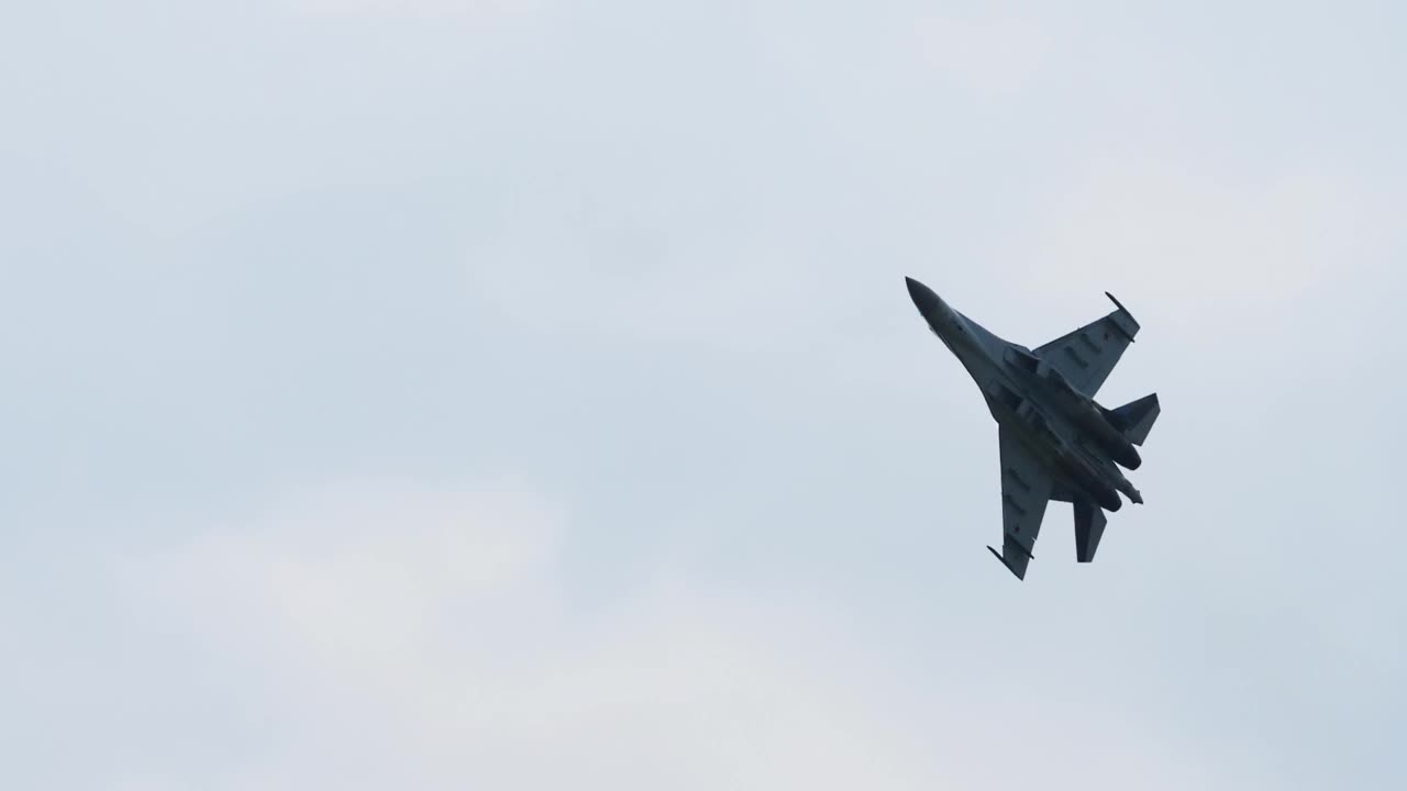 Stock Video Jet Military Aircraft Crosses The Sky Animated Wallpaper