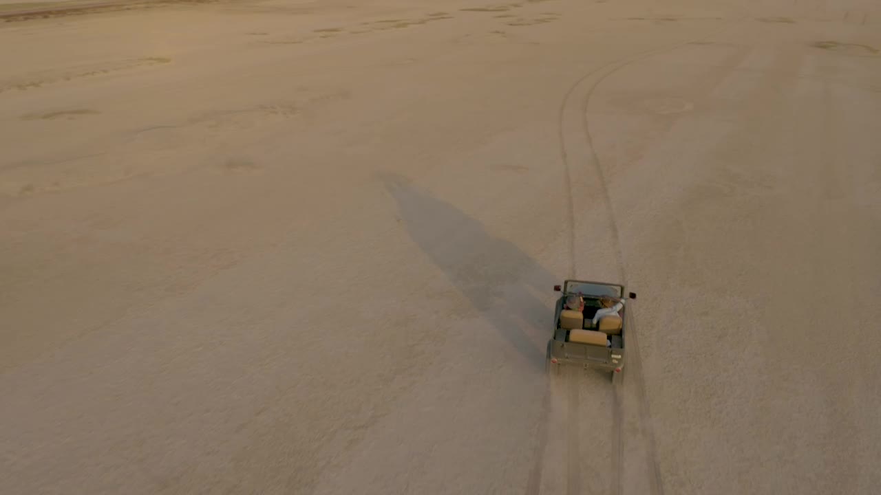 Stock Video Jeep Zigzagging Through An Immense Desert Animated Wallpaper