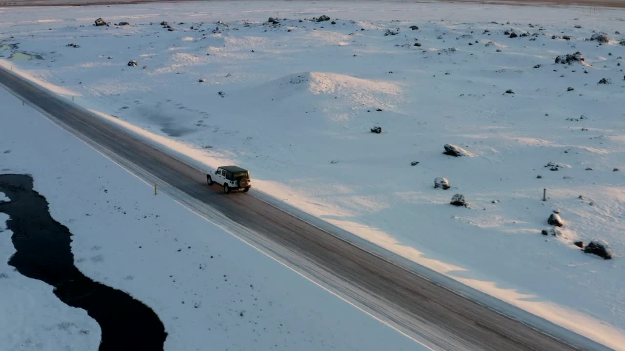 Stock Video Jeep Traveling A Road On A Road Surrounded By Snow Animated Wallpaper