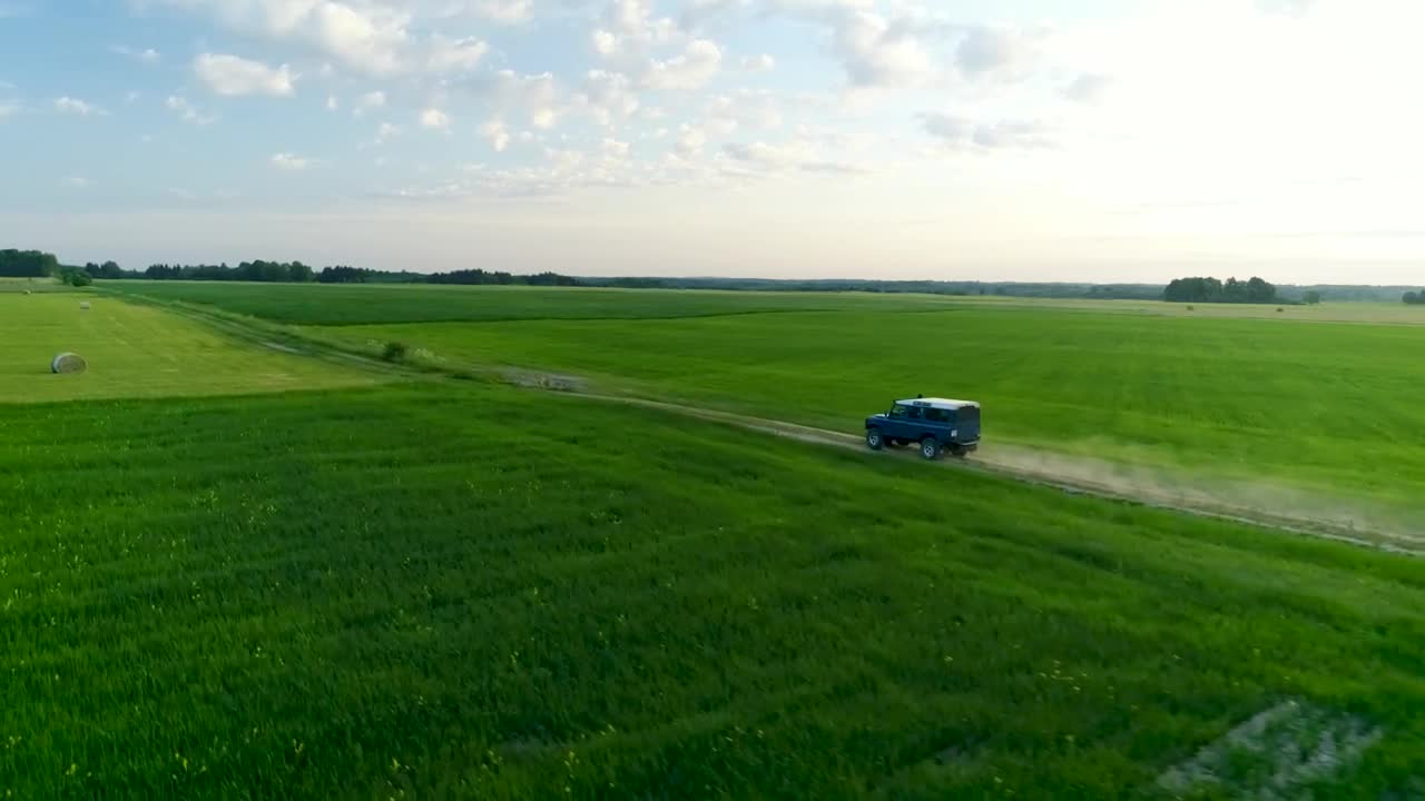Stock Video Jeep Driving Off Road On A Green Field Animated Wallpaper
