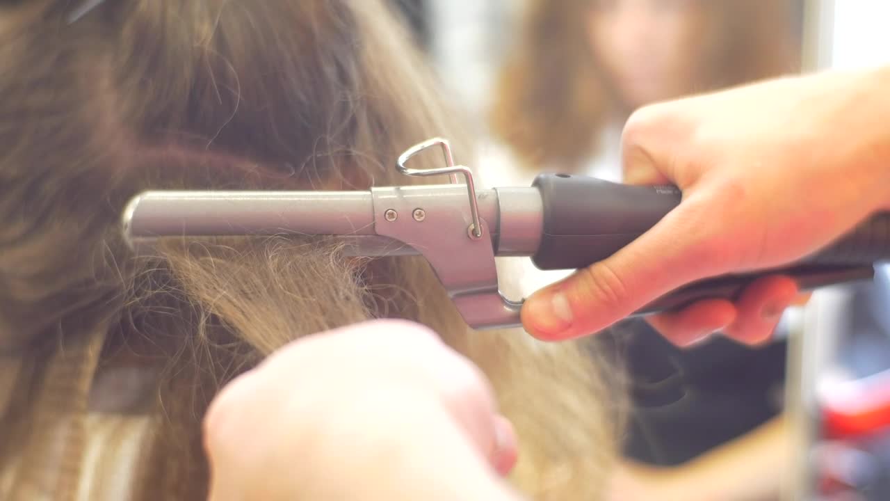 Stock Video Ironing A Womans Hair In The Salon Animated Wallpaper