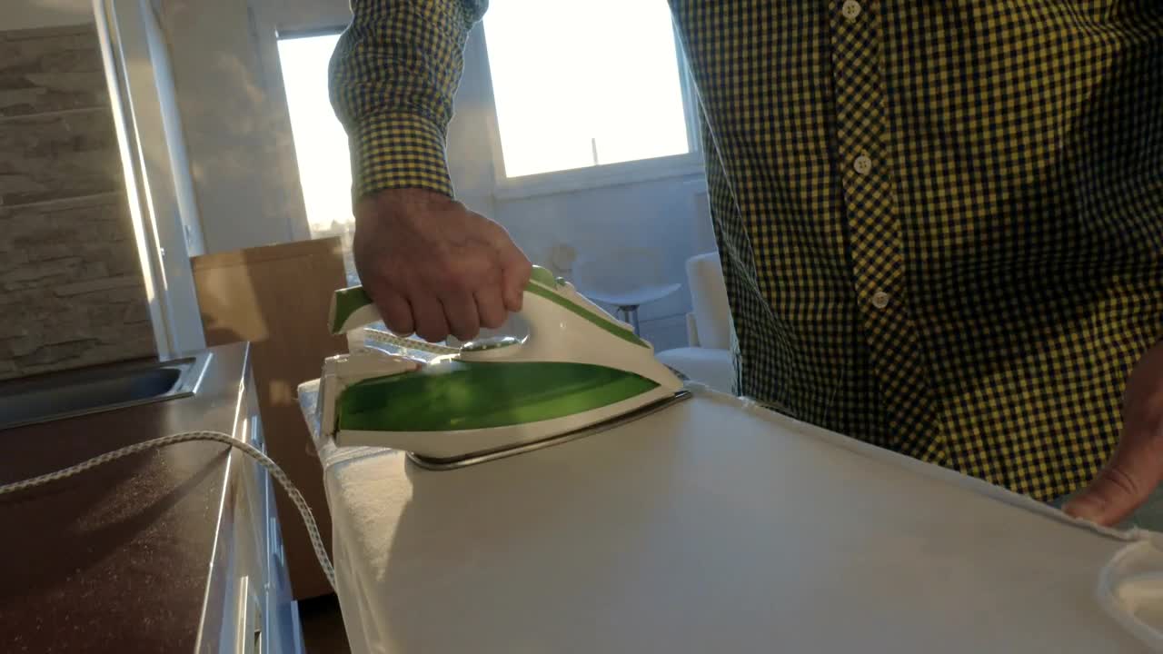 Stock Video Ironing A Shirt At Home Animated Wallpaper