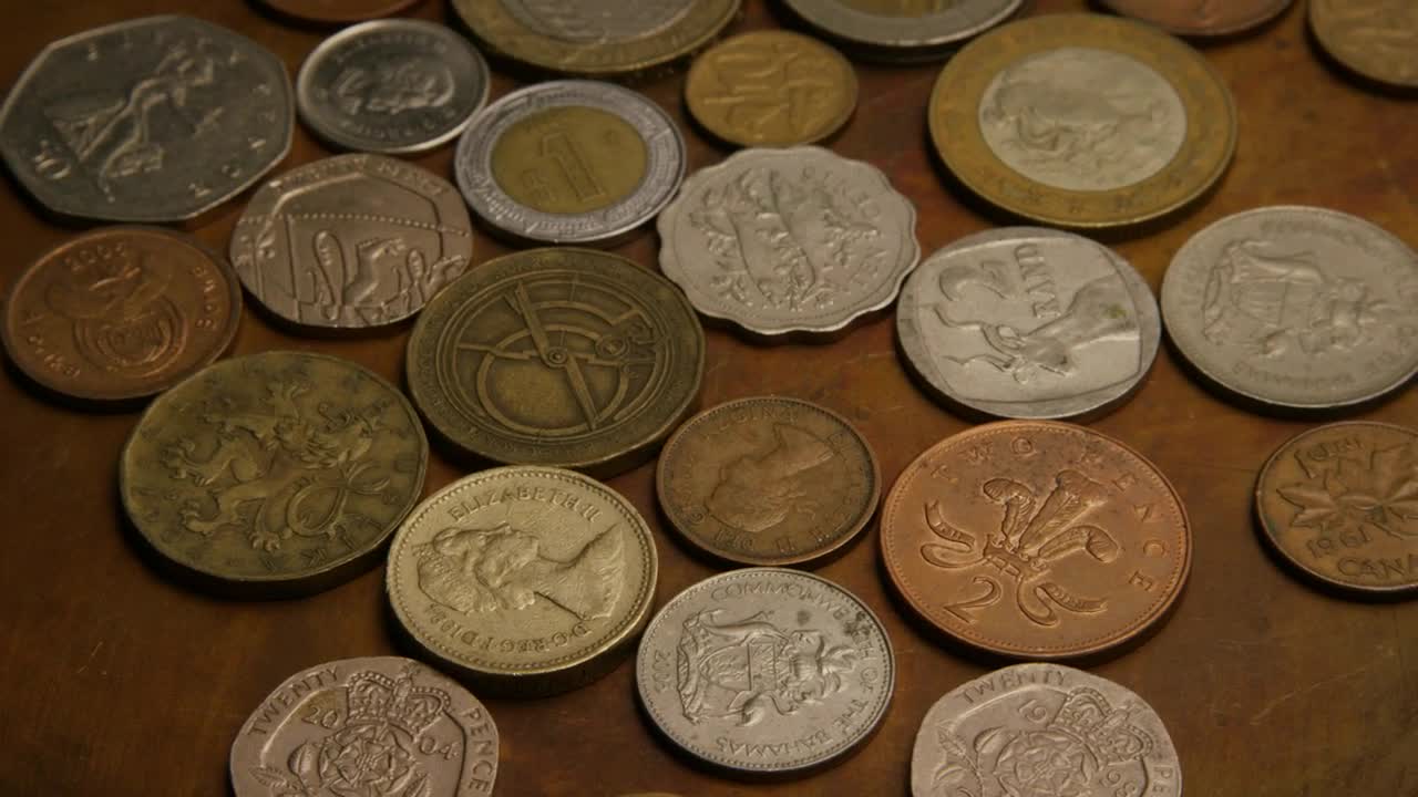 Stock Video International Coins On The Table Animated Wallpaper