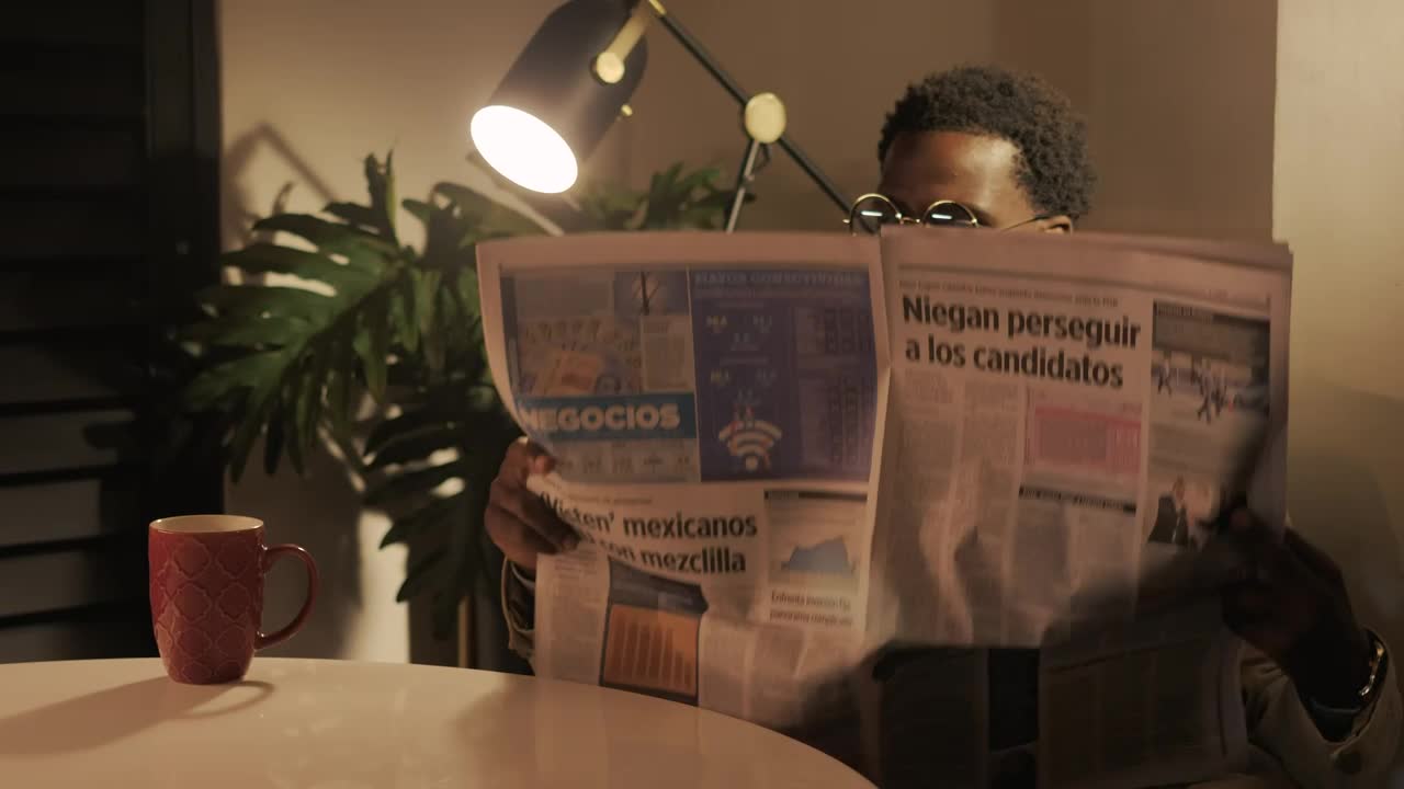 Stock Video Intellectual Man Reading The Newspaper With A Cup Of Coffee 4119 Animated Wallpaper