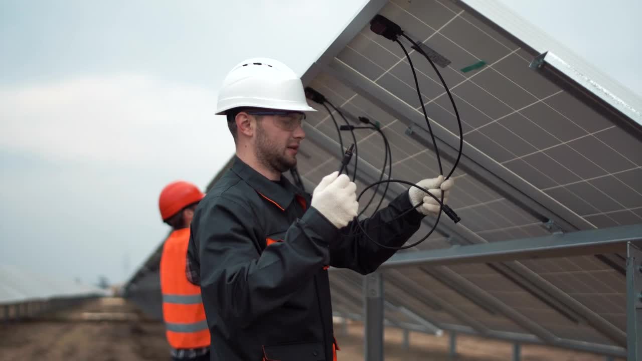 Stock Video Installing Solar Panels On A Cloudy Day Animated Wallpaper