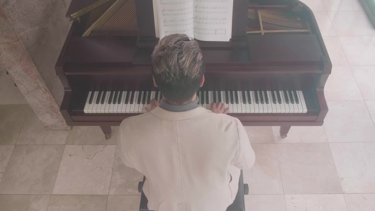 Stock Video Inspired Male Pianist Playing A Grand Piano Animated Wallpaper