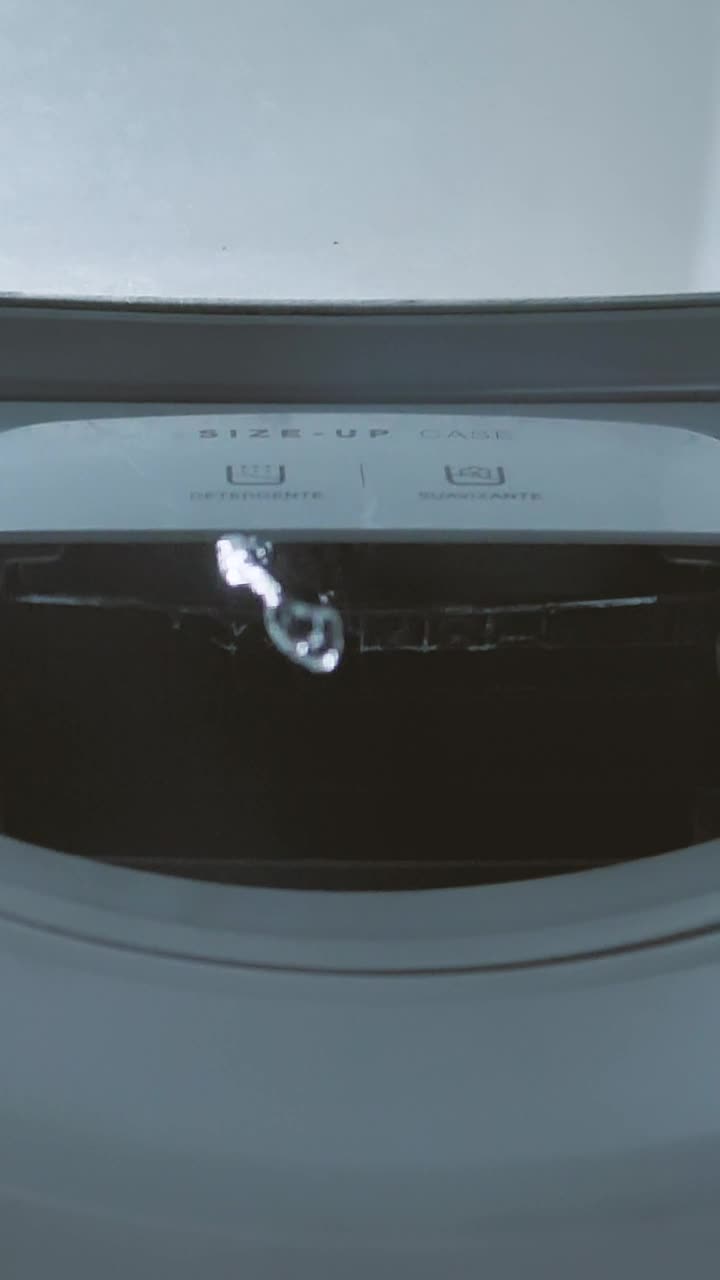 Stock Video Inside Of A Washing Machine While Filling With Water Animated Wallpaper