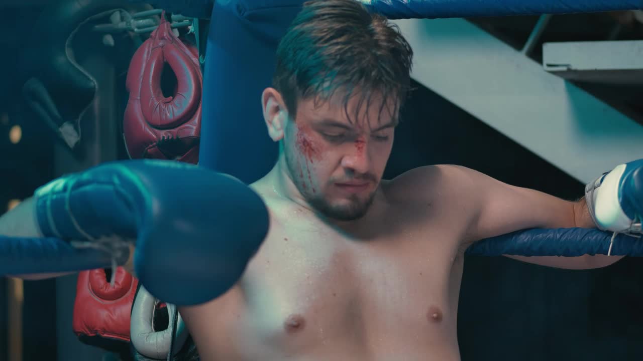 Stock Video Injured Boxer Sitting In The Ring Animated Wallpaper