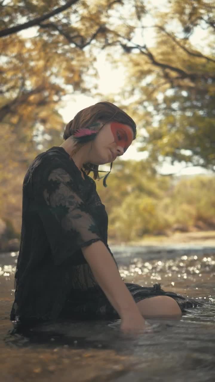 Stock Video Indie Fashion Girl Sitting On Water Animated Wallpaper