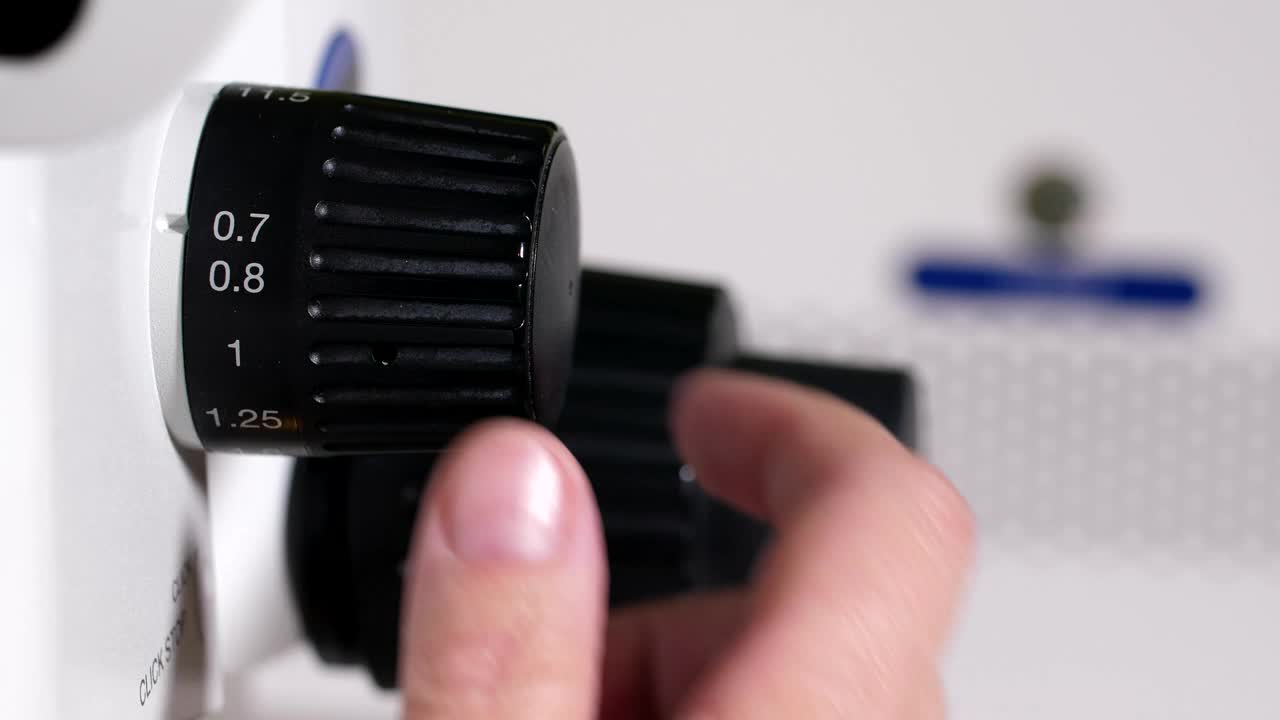 Stock Video Increasing The Zoom On A Microscope Animated Wallpaper