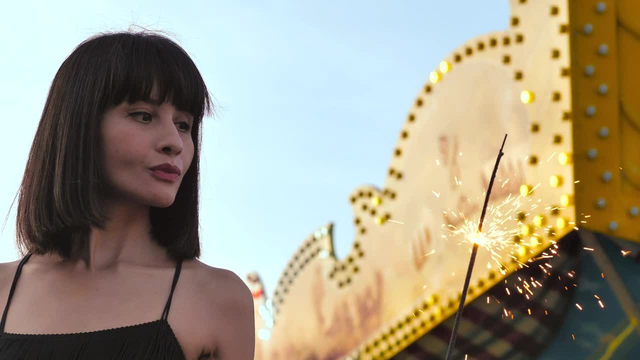 Stock Video Immobile Woman Watching A Sparkler Animated Wallpaper