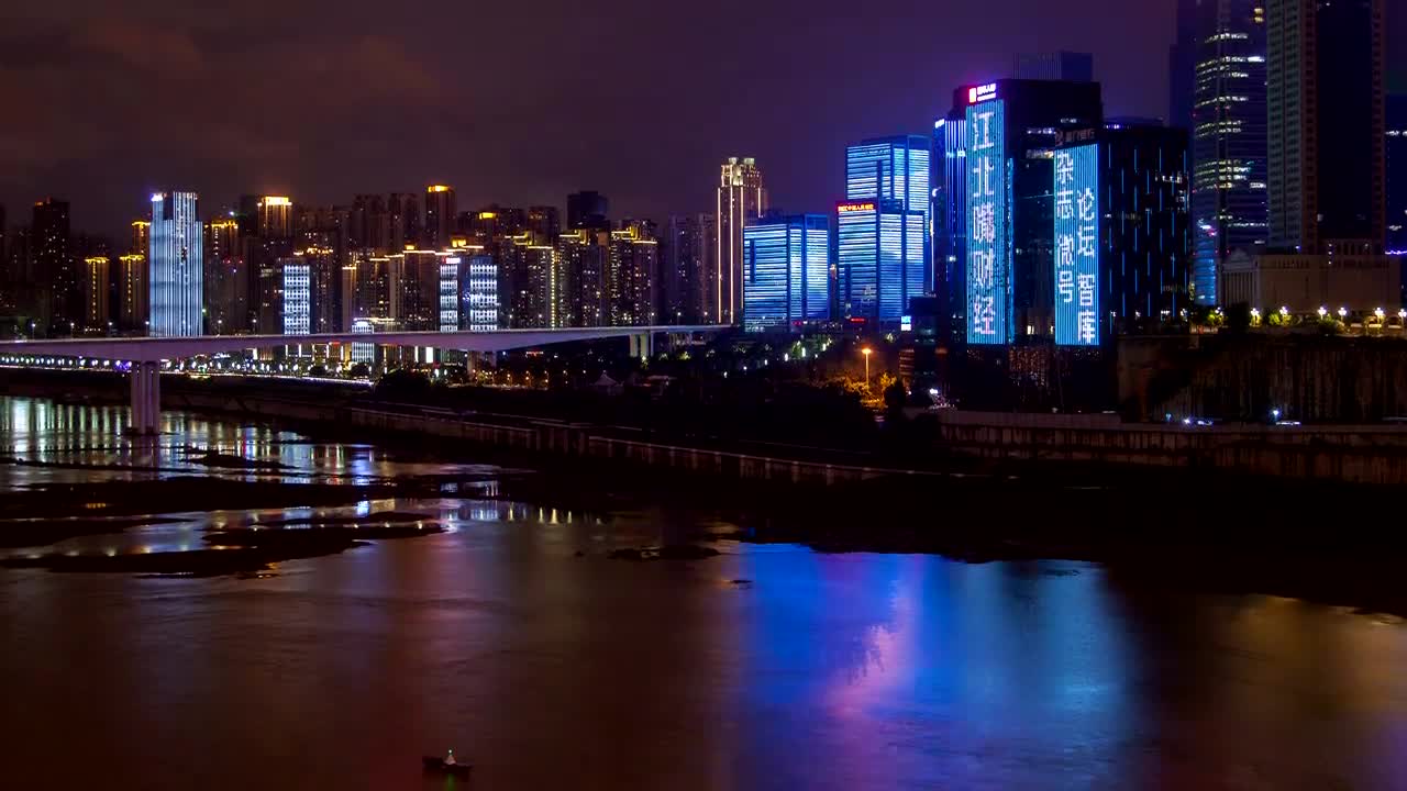 Stock Video Illuminated And Flashing Buildings By The River Animated Wallpaper