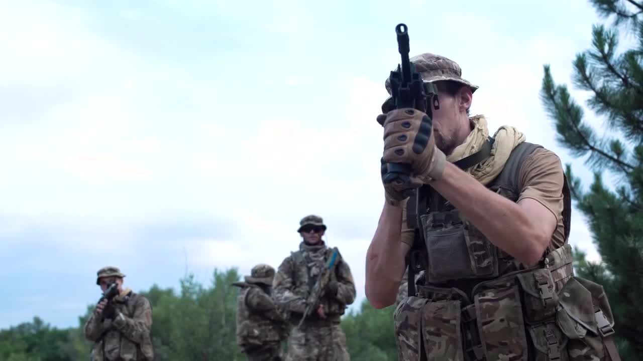 Stock Video Ilitary Men Walking Cautiously On The Battlefield Animated Wallpaper