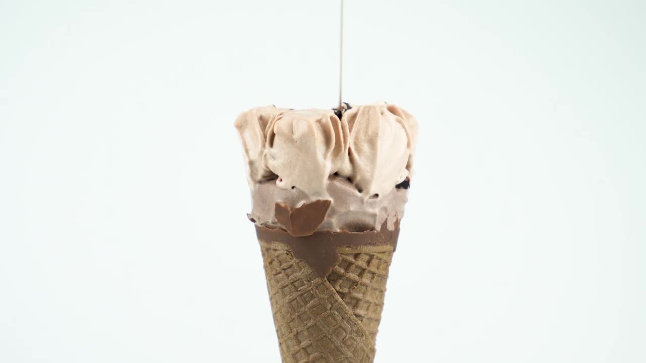 Stock Video Icecream Cone With Syrup On A Light Background Animated Wallpaper