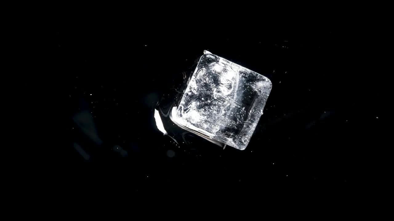 Stock Video Ice Cubes Rotating On Black Background Animated Wallpaper