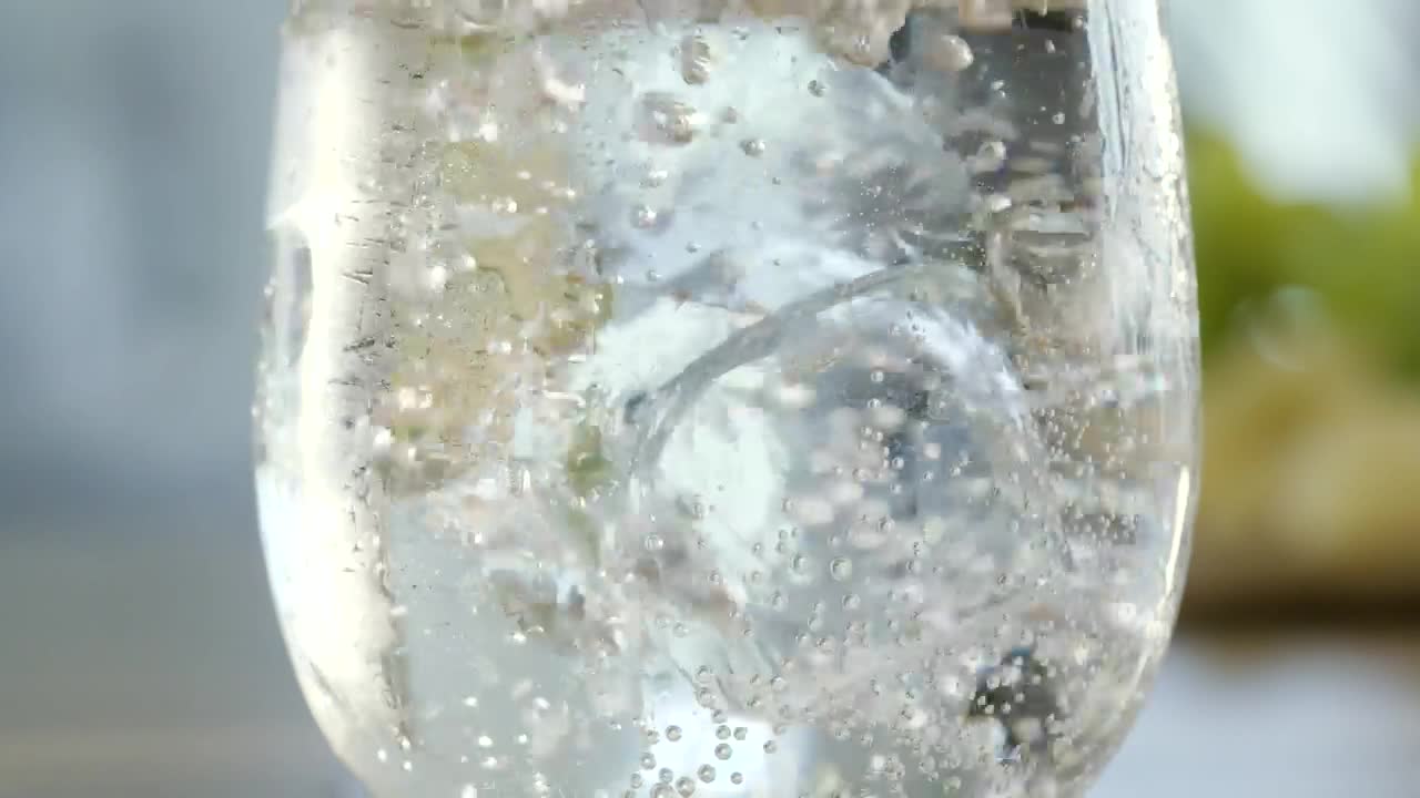 Stock Video Ice Cube Drops Into Mineral Water Animated Wallpaper