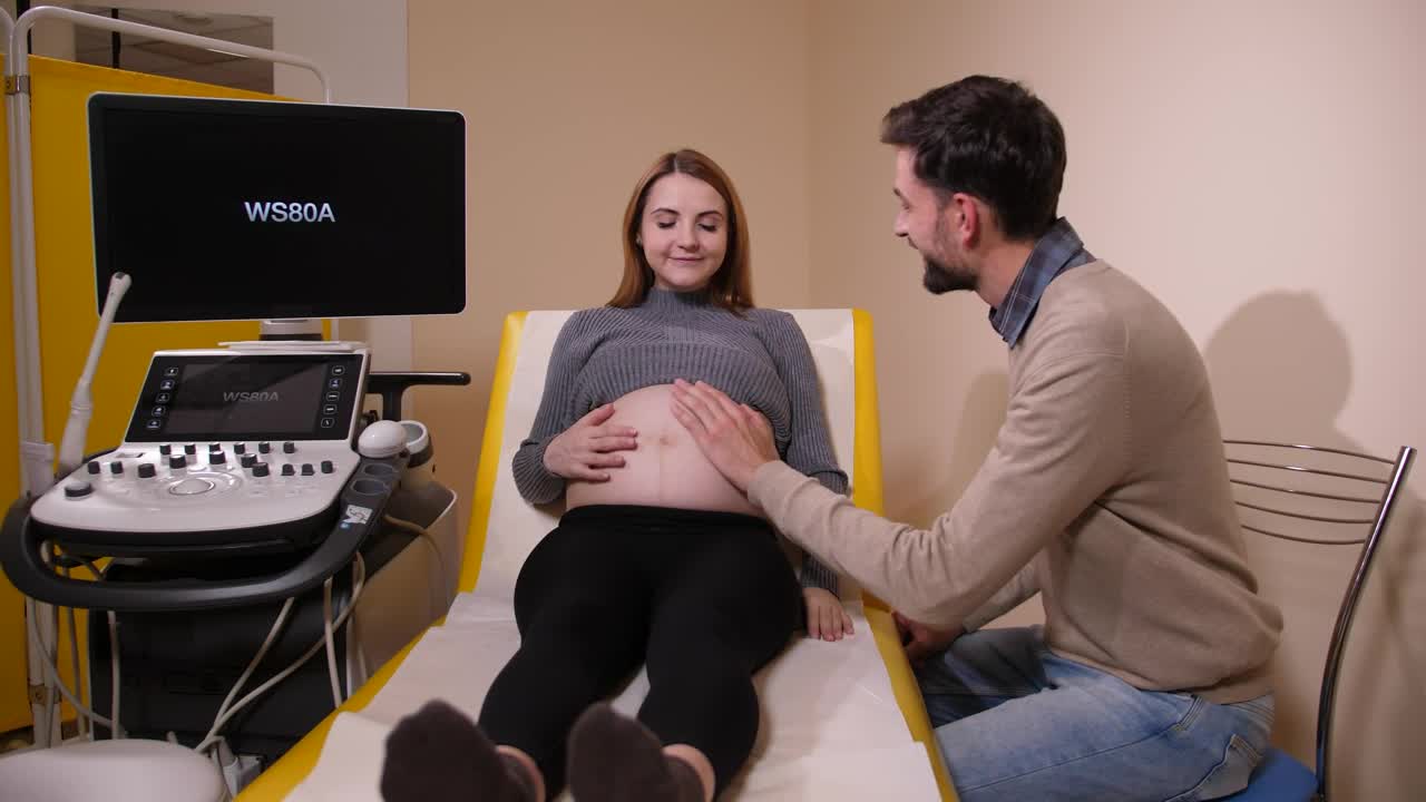 Stock Video Husband Kissing His Pregnant Wife Animated Wallpaper