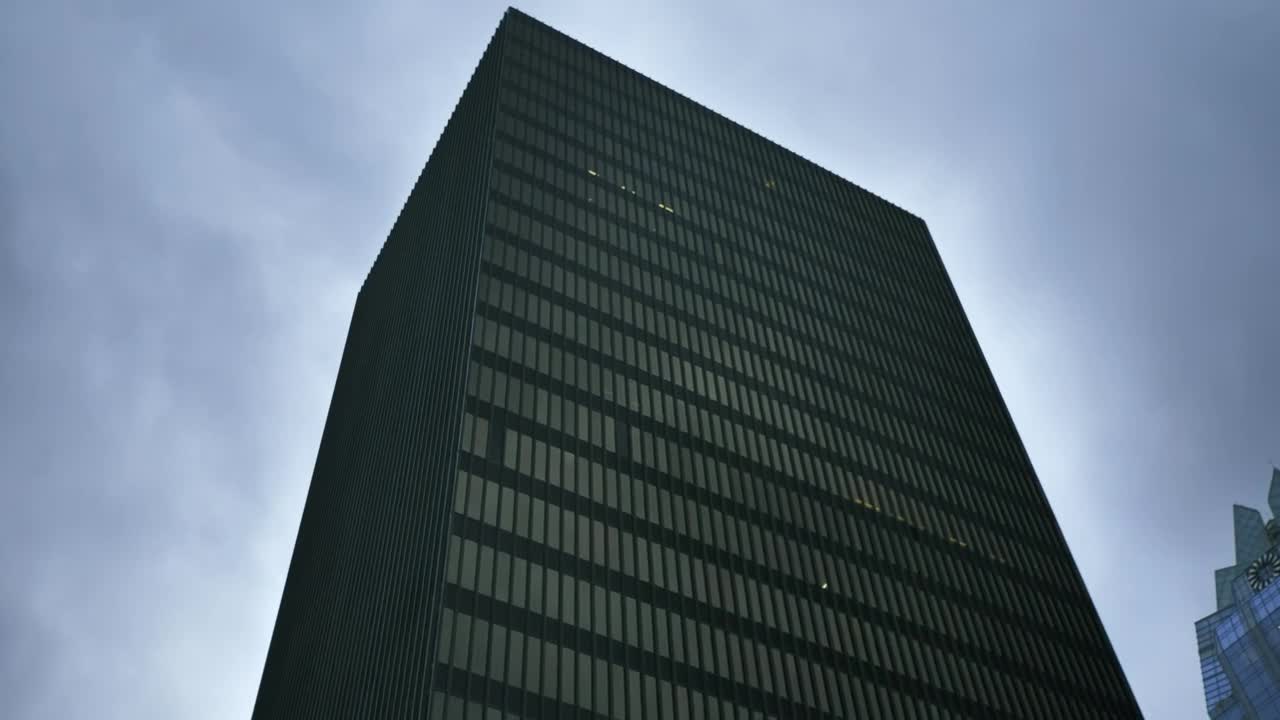 Stock Video Huge Building Covered By Windows Shot From Below Animated Wallpaper