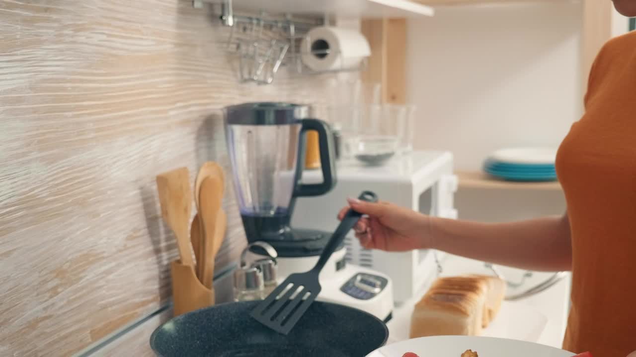 Stock Video Housewife Cooking Breakfast In The Kitchen Animated Wallpaper