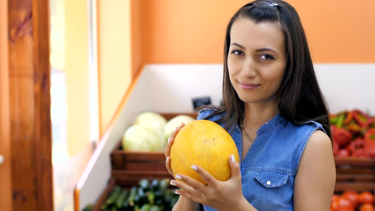 Stock Video Housewife Choosing Fruit At The Market Animated Wallpaper