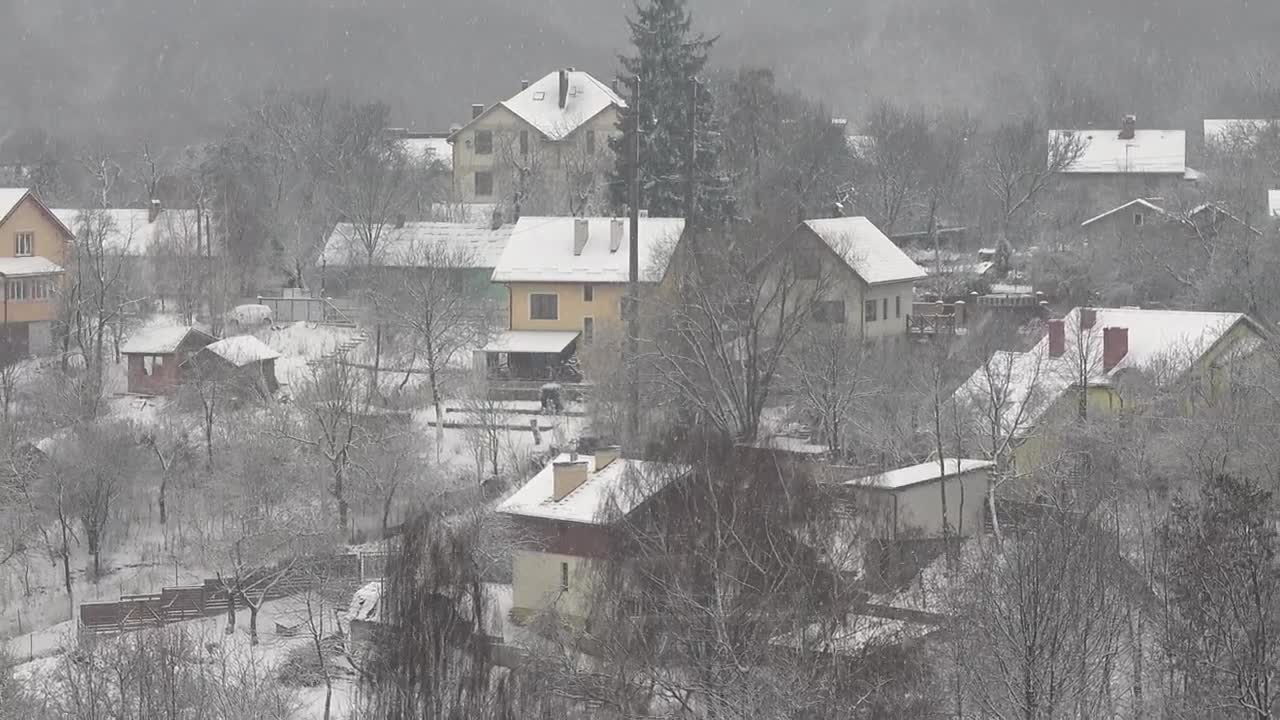 Stock Video Houses During Snowfall Animated Wallpaper