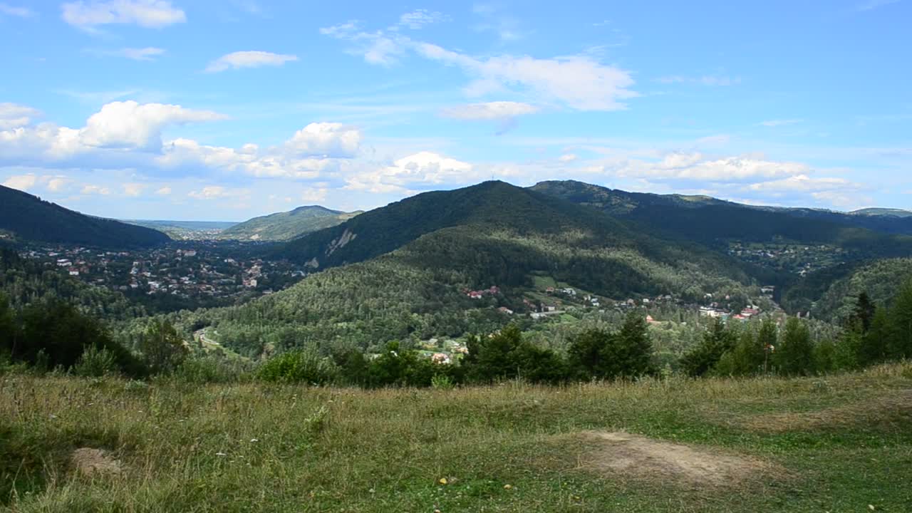 Stock Video Houses Between Mountains Animated Wallpaper