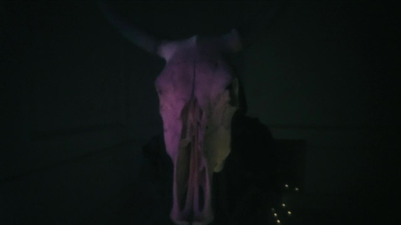 Stock Video Hooded Person Approaching With His Hands A Skull Of A Animated Wallpaper