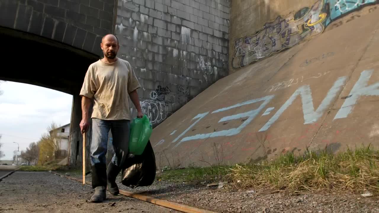 Stock Video Homeless Man Walking With Bags Animated Wallpaper