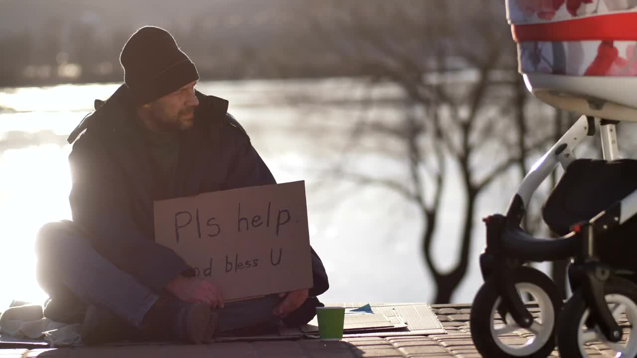 Stock Video Homeless Man On The Street With A Cardboard Sign Animated Wallpaper