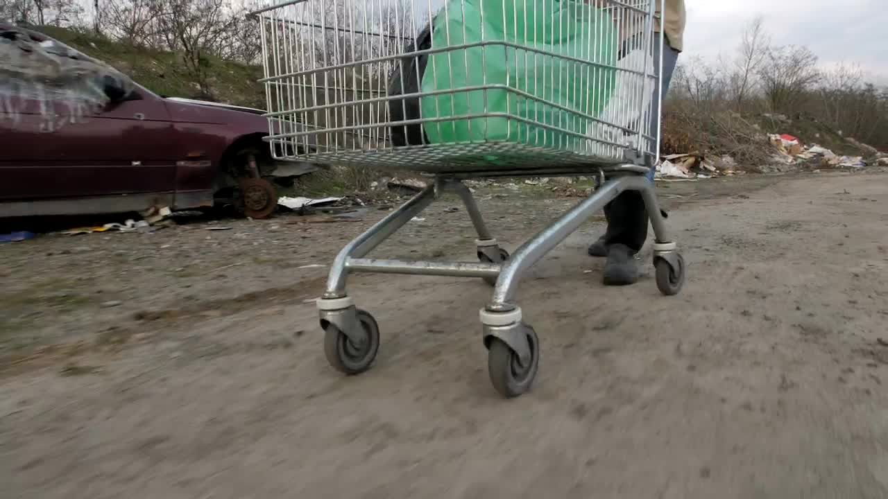 Stock Video Homeless Man Going Through A Garbage Can Animated Wallpaper
