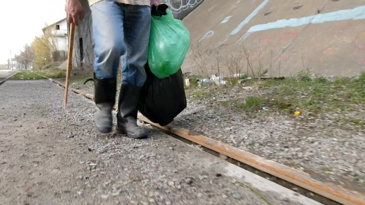 Stock Video Homeless Man Collecting Bottles Animated Wallpaper